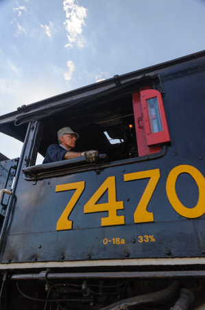 North Conway Village, New Hampshire, USA - September 25, 2010: Engineer pulling Conway Scenic Railroad #7470 into station at North Conway Villageのeditorial素材