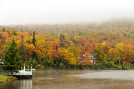 Dixville Notch, New Hampshire, USA - October 1, 2009: Rainy day at The Balsams on Lake Gloriette brings out colors in fall foliageのeditorial素材