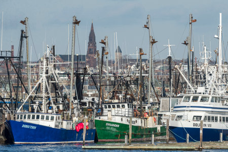 Fairhaven, Massachusetts, USA - December 26, 2017: Fishing boats and ferry docked in Fairhaven with New Bedford in backgroundのeditorial素材