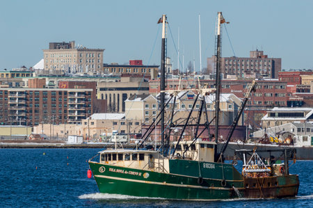 New Bedford, Massachusetts, USA - January 31, 2018: Commercial fishing boat Vila Nova do Corvo II with New Bedford waterfront in backgroundのeditorial素材
