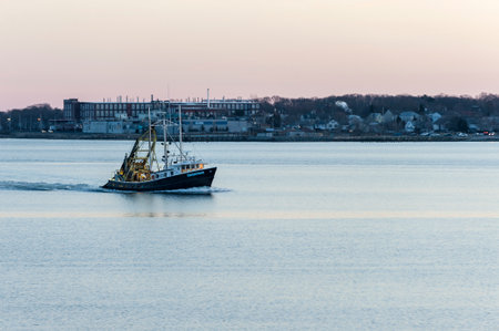 New Bedford, Massachusetts, USA - February 18, 2018: Commercial fishing vessel Enterprise in New Bedford outer harbor on calm eveningのeditorial素材