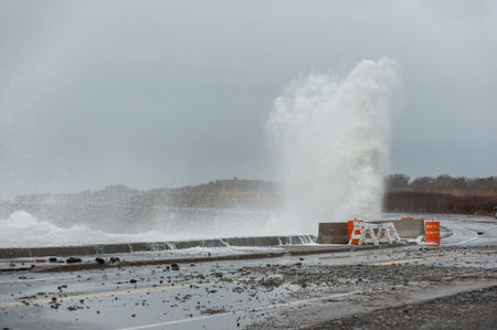Destructive wave damaging seawall along Ocean Drive in Newport, Rhode Islandの写真素材