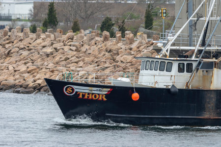 New Bedford, Massachusetts, USA - May 3, 2019: Commercial fishing vessel Thor transiting New Bedford...
