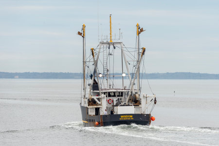 New Bedford, Massachusetts, USA - May 1, 2019: Scalloper Wisdom heading into Buzzards Bay on its way...