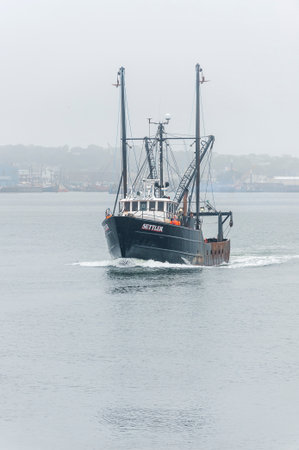 New Bedford, Massachusetts, USA - July 12, 2019: Commercial fishing vessel Settler, hailing port...