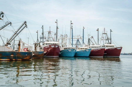 Fairhaven, Massachusetts, USA - July 4, 2019: Commercial fishing vessels docked five deep at Union Wharf in Fairhaven under hazy summer skies on Independence Dayのeditorial素材
