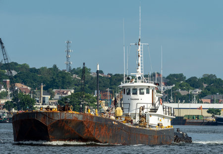 New Bedford, Massachusetts, USA - July 2, 2019: Tug Thuban pushing fuel barge Meropa 900 on Acushnet Riverのeditorial素材