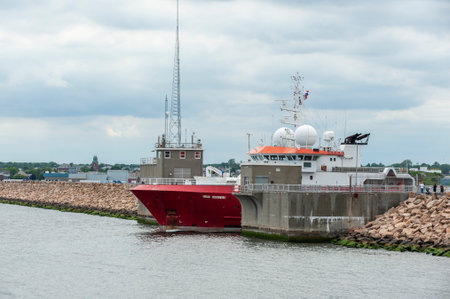 New Bedford, Massachusetts, USA - June 17, 2019: Survey vessel Fugro Discovery transiting the New Bedford hurricane barrier on her way to waters east of Block Islandのeditorial素材
