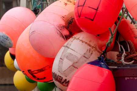 New Bedford, Massachusetts, USA - October 12, 2019: Colorful buoys hanging off side of lobster boat Fishing Addiction 2017のeditorial素材