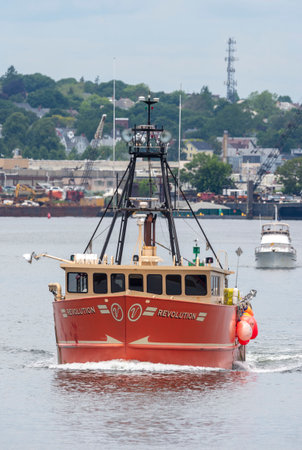 New Bedford, Massachusetts, USA - June 17, 2019: Lobster boat Revolution heading out of New Bedford...