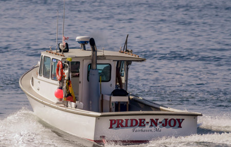 Fairhaven, Massachusetts, USA - August 4, 2019: Lobster boat Pride-N-Joy outbound on Acushnet River