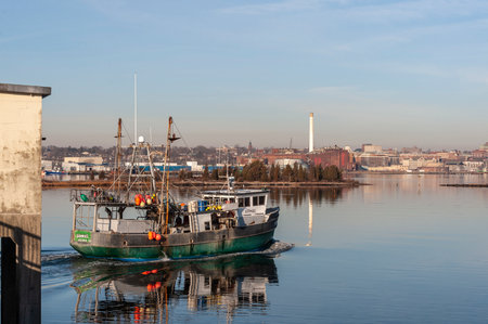 New Bedford, Massachusetts, USA - January 23, 2020: Commercial fishing boat Shamrock transiting hurricane protection barrierのeditorial素材