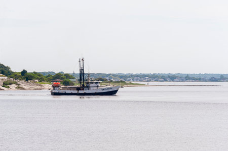 New Bedford, Massachusetts, USA â July 17, 2019: Longliner White Water, hailing port Marathon, FL, passing Fort Phoenixのeditorial素材