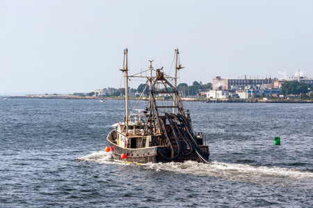 New Bedford, Massachusetts, USA - August 7, 2019: Clammer Enterprise  crossing New Bedford outer harbor on a summer morningのeditorial素材