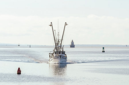 New Bedford, Massachusetts, USA - March 12, 2020: Commercial fishing boat Atlantic Queen, hailing port Wakefield, RI, coming out of Buzzards Bayのeditorial素材