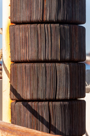 Rubber bumper protecting heavy equipment on commercial fishing vessel