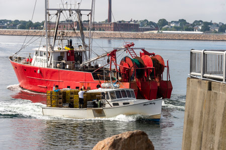 New Bedford, Massachusetts, USA - September 15, 2018: Dragger Fisherman and lobster boat Miss Molly on the move in New Bedford harborのeditorial素材