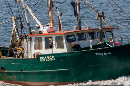 New Bedford, Massachusetts, USA - July 3, 2018: Commercial fishing vessel Rhiley Donn nearing New...