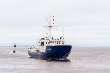 New Bedford, Massachusetts, USA - May 28, 2018: Offshore survey vessel Kommandor Iona coming out of Buzzards Bay bound for New Bedford on cloudy morningのeditorial素材