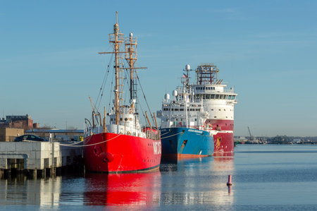 New Bedford, Massachusetts, USA - April 24, 2018: Geotechnical drilling vessel Dina Polaris, research vessel Ocean Researcher and decommissioned Nantucket lightship strung out along future New Bedford Marine Commerce Terminalのeditorial素材