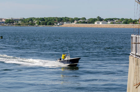 Fairhaven, Massachusetts, USA - June 14, 2018: Fishermen returning from a morning trip