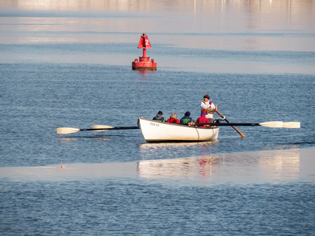 Fairhaven, Massachusetts, USA - March 1, 2018: Members of Buzzards Bay Rowing Club power whaleboat...