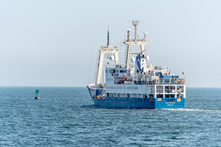 New Bedford, Massachusetts, USA - May 15, 2020: Multi-role survey vessel Ocean Observer steaming toward Buzzards Bay on foggy Spring afternoonのeditorial素材