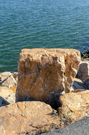 Granite boulders making up the miles-long sections of hurricane protection barriers protecting New Bedford and Fairhavenのeditorial素材