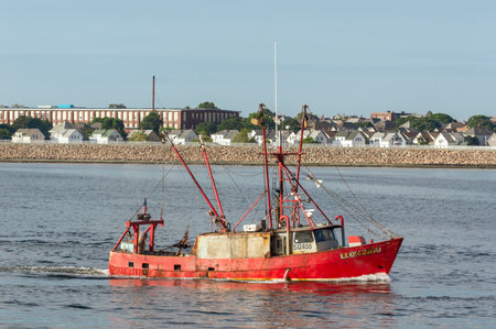 New Bedford, Massachusetts, USA - September 5, 2018: Scalloper Leonardo on Acushnet River with New Bedford waterfront in backgroundのeditorial素材