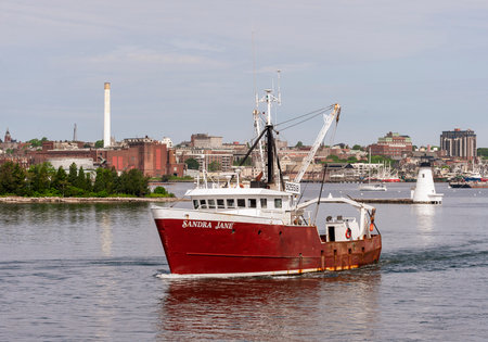 New Bedford, Massachusetts, USA - June 9, 2020: Scalloper Sandra Jane crossing New Bedford inner harbor on her way fishingのeditorial素材
