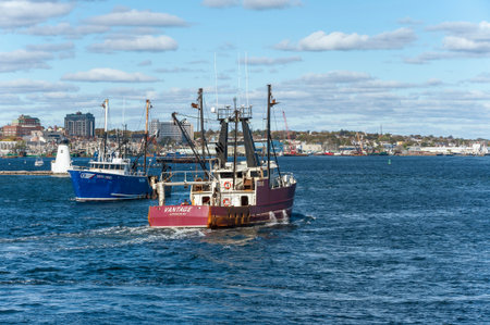 New Bedford, Massachusetts, USA - October 30, 2018: Commercial fishing vessels Santa Isabel and Vantage passing Palmer Island Light Stationのeditorial素材