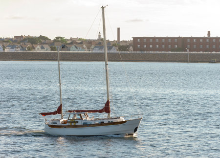 New Bedford, Massachusetts, USA - September 14, 2018: Sailboat Puffin, hailing port Appleton, Maine, crossing New Bedford outer harbor near sunsetのeditorial素材