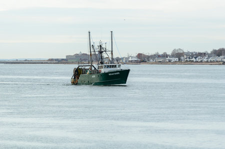 New Bedford, Massachusetts, USA - March 28, 2018: Fishing vessel Megan Marie passing Fort Taber in outer New Bedford harborのeditorial素材