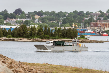 New Bedford, Massachusetts, USA - June 10, 2020: Old landing craft leaving New Bedford with truck...