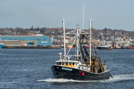 New Bedford, Massachusetts, USA - March 23, 2018: Clammer Enterprise with New Bedford waterfront in backgroundのeditorial素材