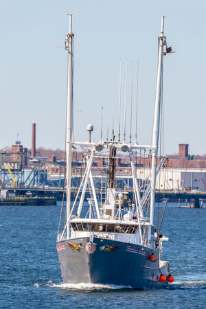 New Bedford, Massachusetts, USA - March 31, 2018: Fishing vessel Fortune Hunter, hailing port Norfolk, Virginia, leaving New Bedford on fishing tripのeditorial素材