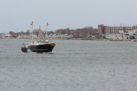 New Bedford, Massachusetts, USA - March 21, 2018: Choppy water slapping starboard side of fishing vessel Nordic Prideのeditorial素材
