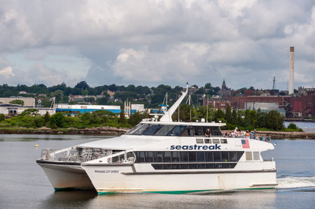 New Bedford, Massachusetts, USA - July 1, 2020: High-speed ferry Whaling City Express leaving New Bedford under threatening cloudsのeditorial素材