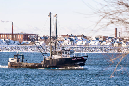 New Bedford, Massachusetts, USA - January 1, 2018: Fishing vessel Amber Nicole, hailing port Cape May, New Jersey, approaching New Bedford on cold and windy morningのeditorial素材