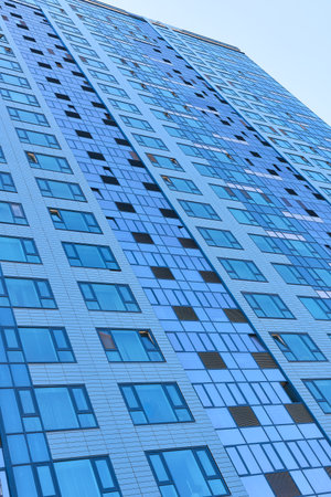 Novosibirsk, Siberia, Russia - May 9, 2022. Part of the glass facade of the house. Glazing of the...