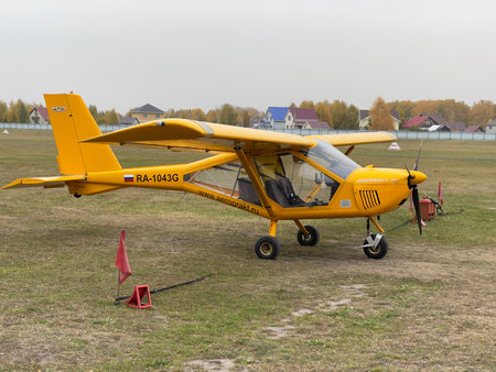 Novosibirsk, Siberia, Russia - September 25, 2022. Light-engine airplane, yellow, close-up....
