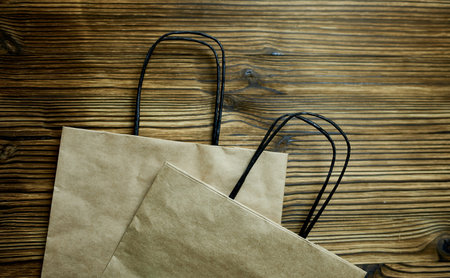 paper bags on wooden backgroundの写真素材