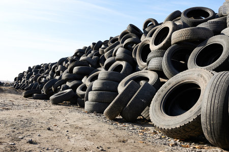 Novosibirsk, Siberia, Russia - October 17, 2021. Landfill with old tires for the disposal of car tires and for recycling. The concept is environmental pollution.のeditorial素材