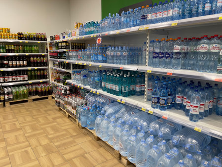 Novosibirsk, Siberia, Russia - August 27, 2022. Drinking water display case in the Lenta supermarket.のeditorial素材