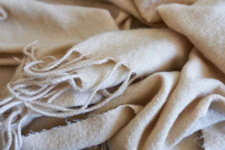 beige woolen fabric texture, close-up, soft focusの写真素材