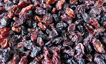 Black raisins as a background. close-up shot.の写真素材