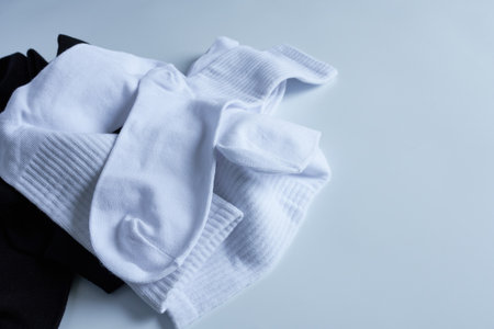 white and black socks on a white background. copyspace.の写真素材