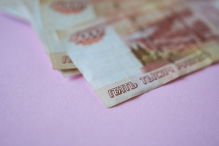 Russian ruble banknotes on a pink background. Selective focus.の写真素材