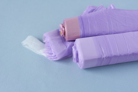 Rolls of lavender fabric on blue background. Copy space.の写真素材