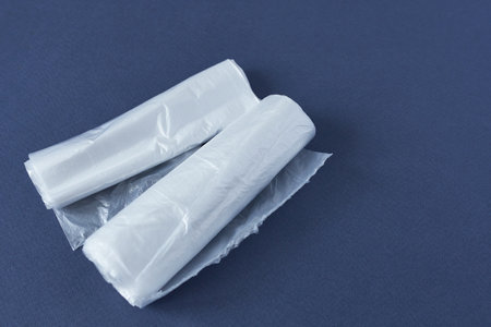 Disposable grocery bags on blue background, space for copy.の写真素材